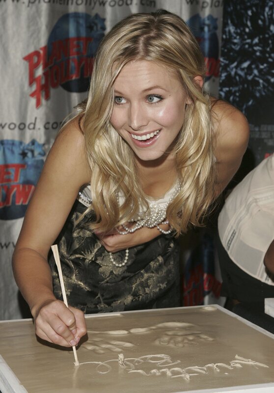woman signing autograph