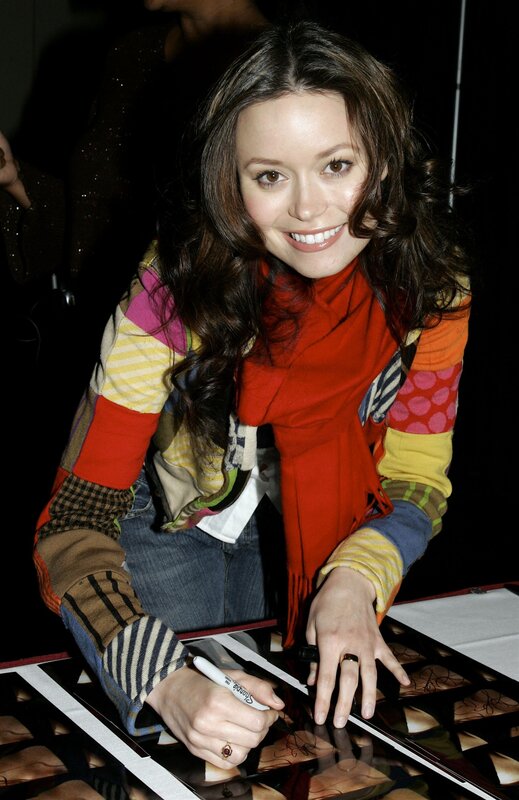 woman signing autographs