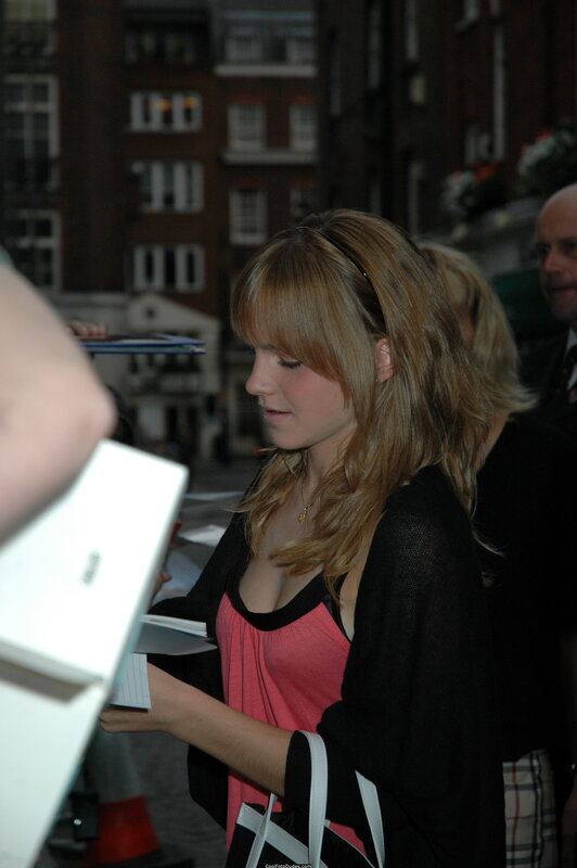 woman signing autographs