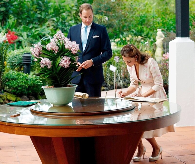 Woman Signing Guest Book