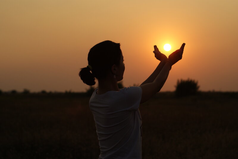 Woman Silhouetted at Sunset — Orange