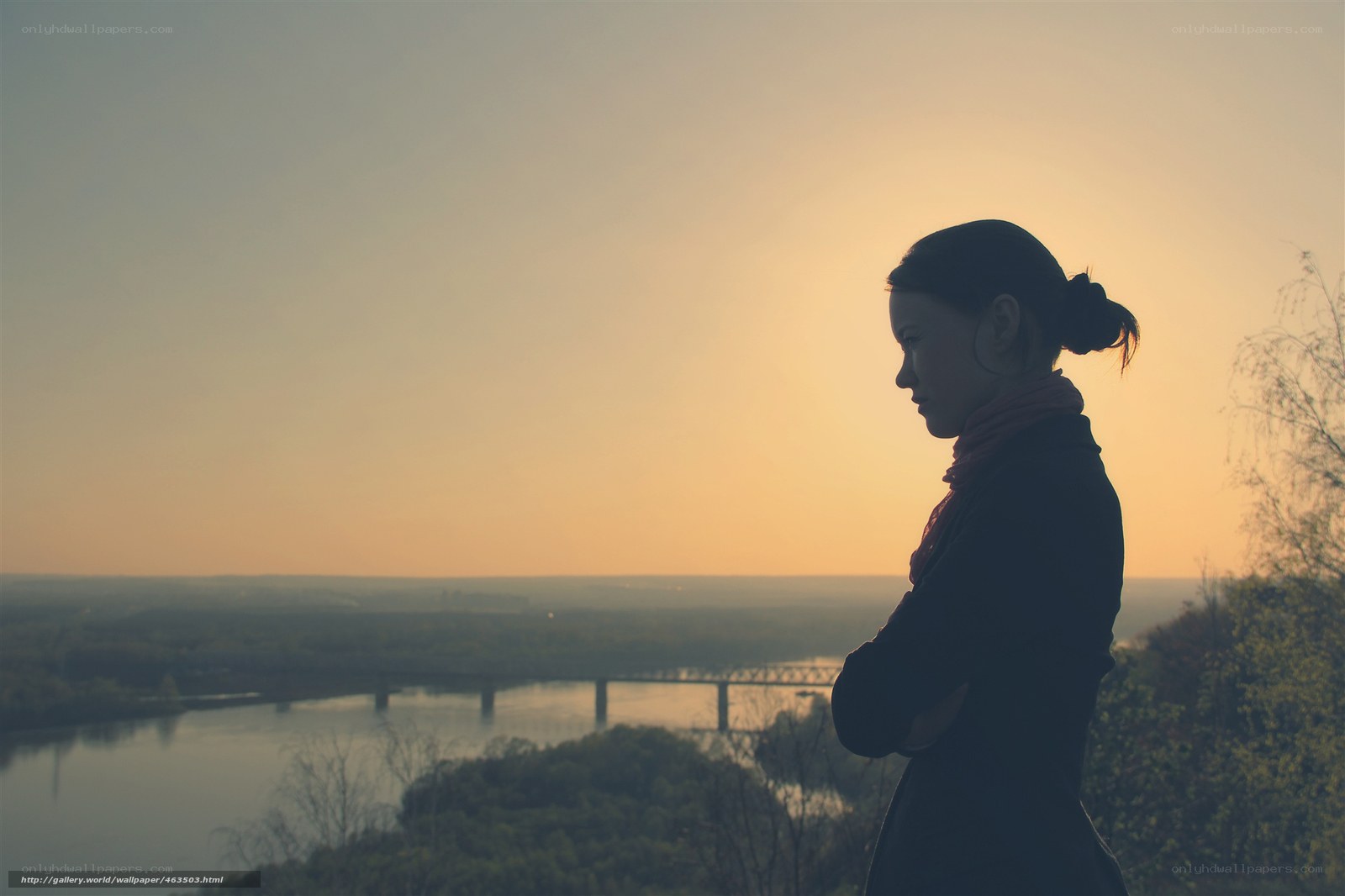 woman silhouetted at sunset