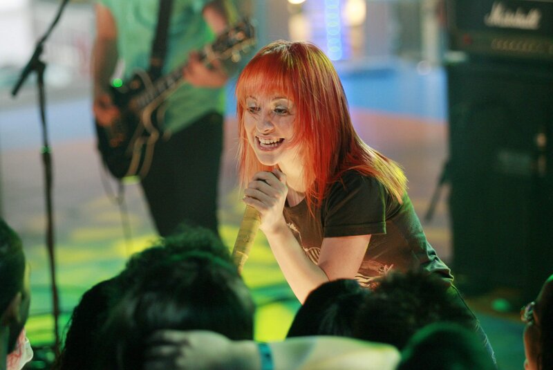 Woman singing at a concert