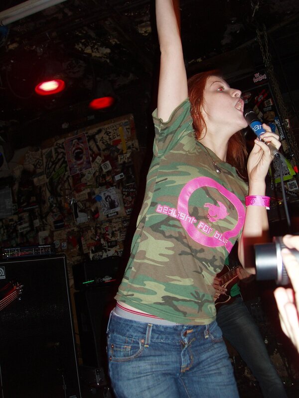 woman singing at a concert