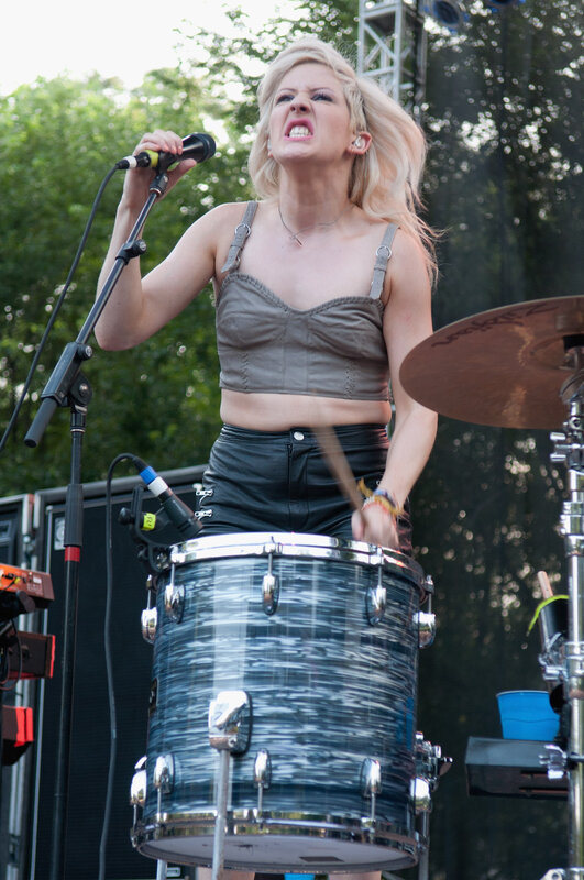 Woman singing at a concert