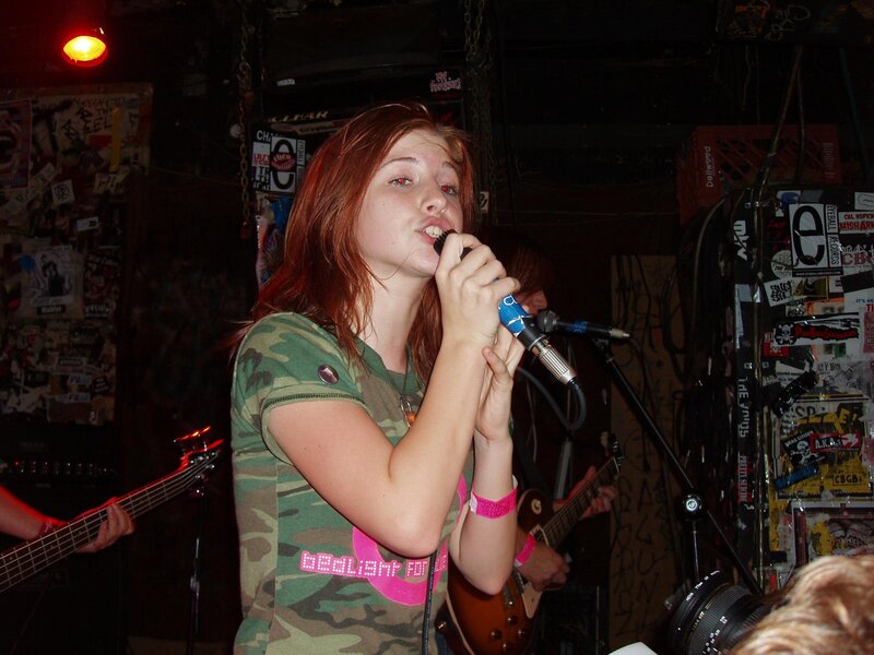 woman singing at a concert