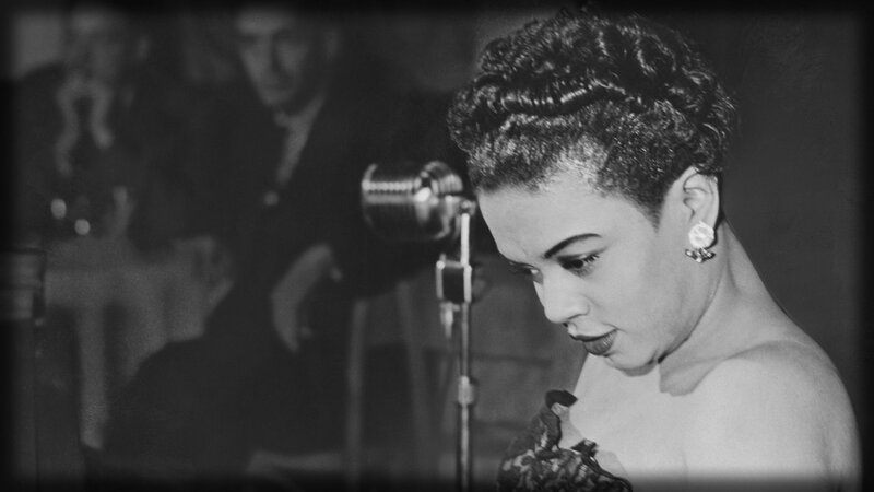woman singing at a microphone