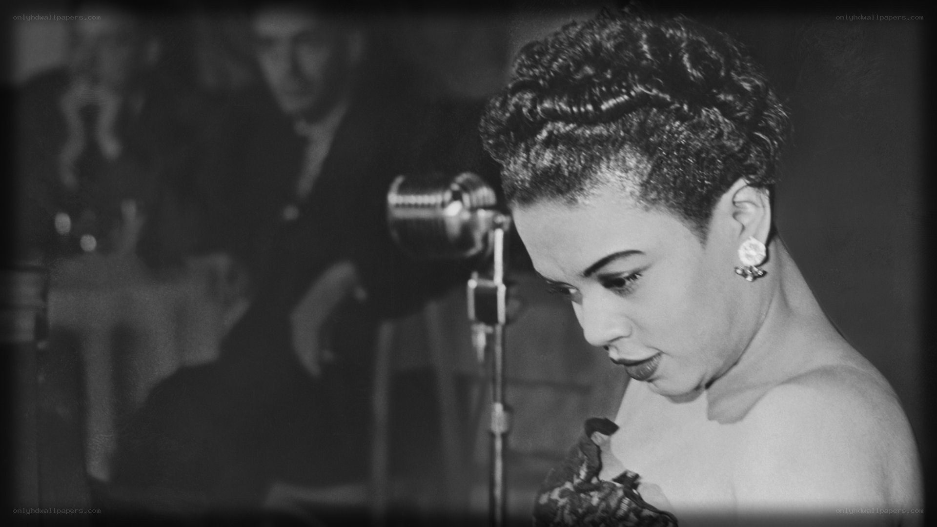 woman singing at a microphone
