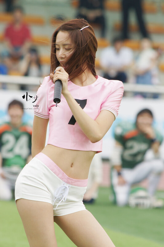 woman singing at a stadium