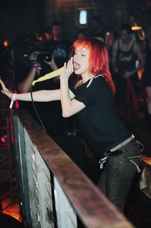woman singing at concert