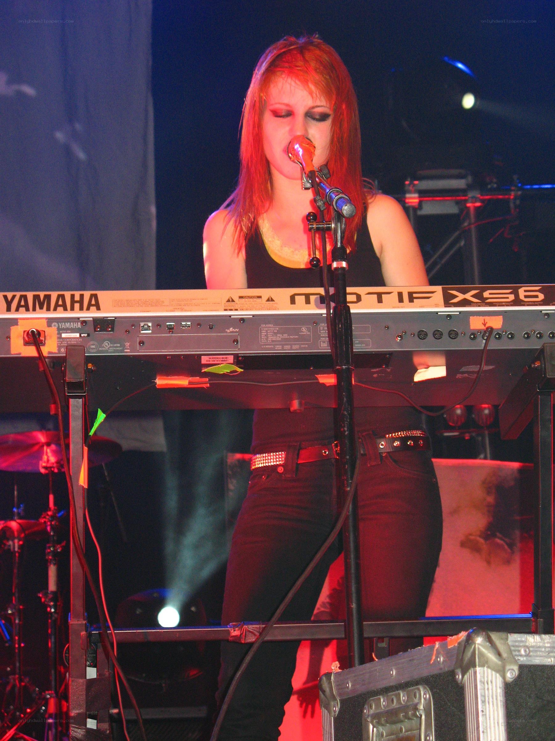 woman singing at keyboard