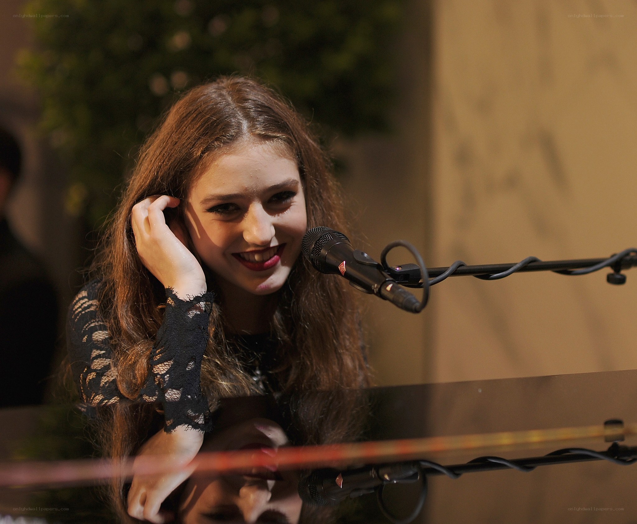 woman singing at microphone