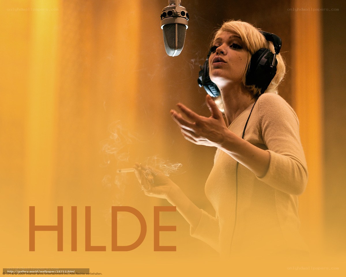 Woman singing in a recording studio