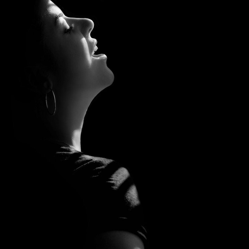 woman singing in profile