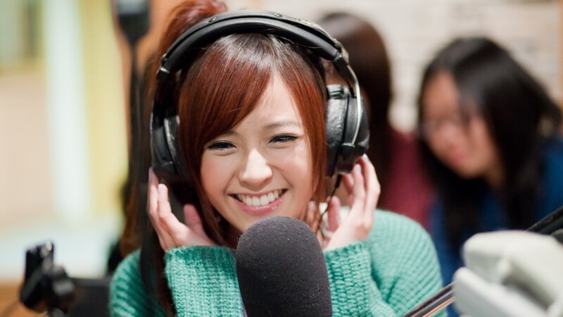 woman singing in recording studio