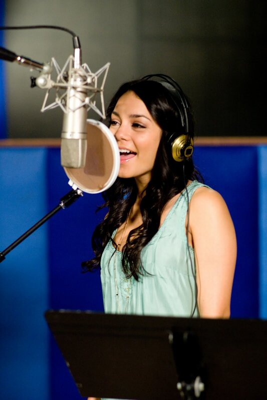 woman singing in recording studio