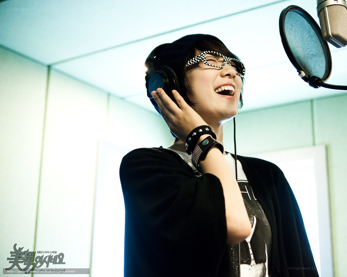 woman singing in recording studio