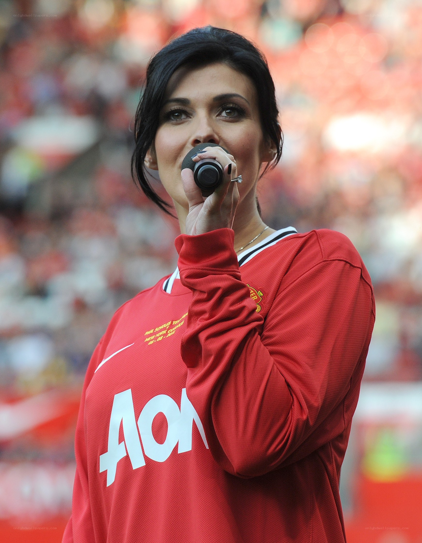 woman singing in red jersey