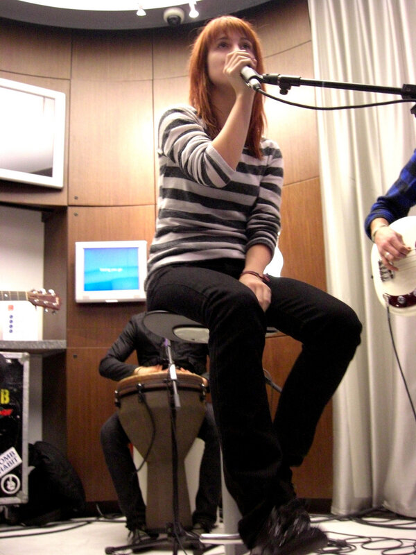 Woman singing into a microphone