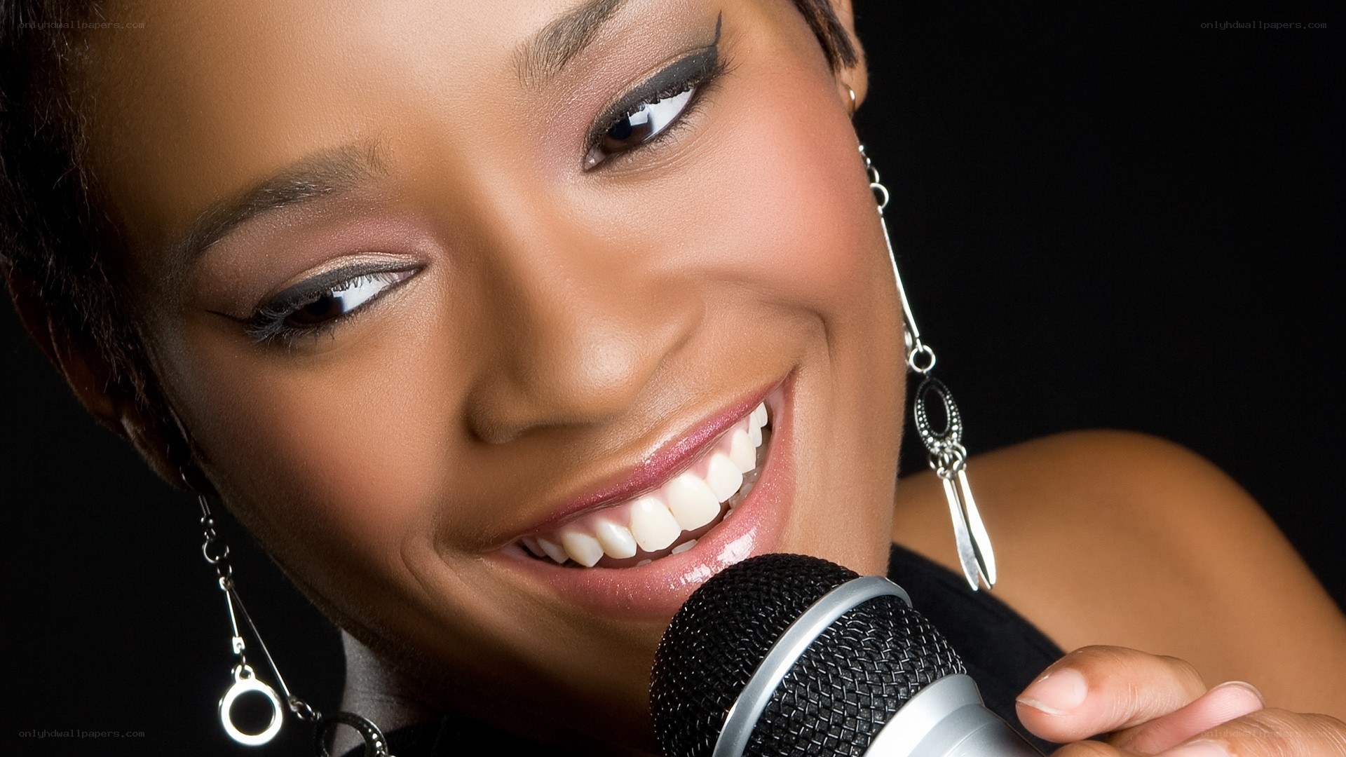 woman singing into microphone