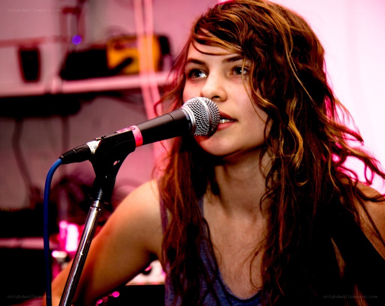 woman singing into microphone