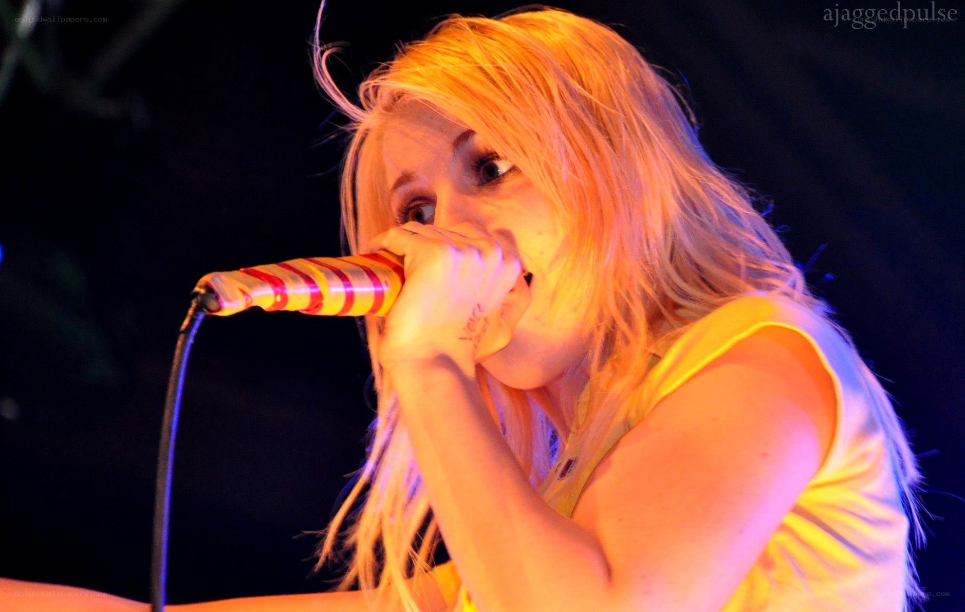 woman singing into microphone