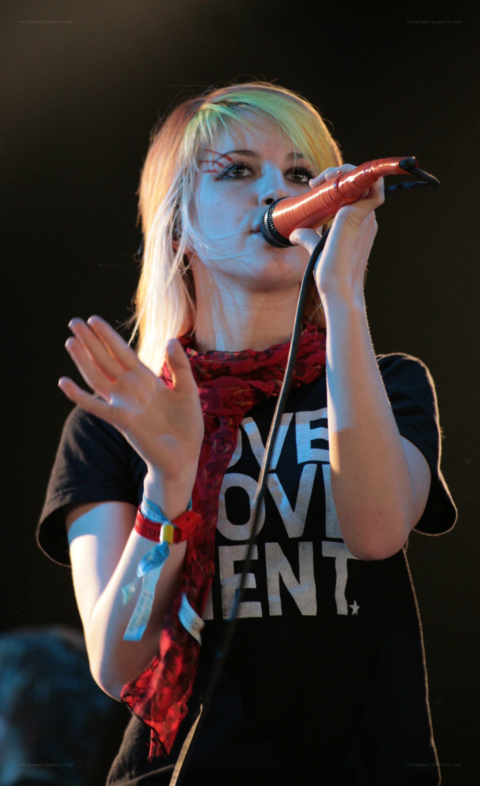 woman singing into microphone