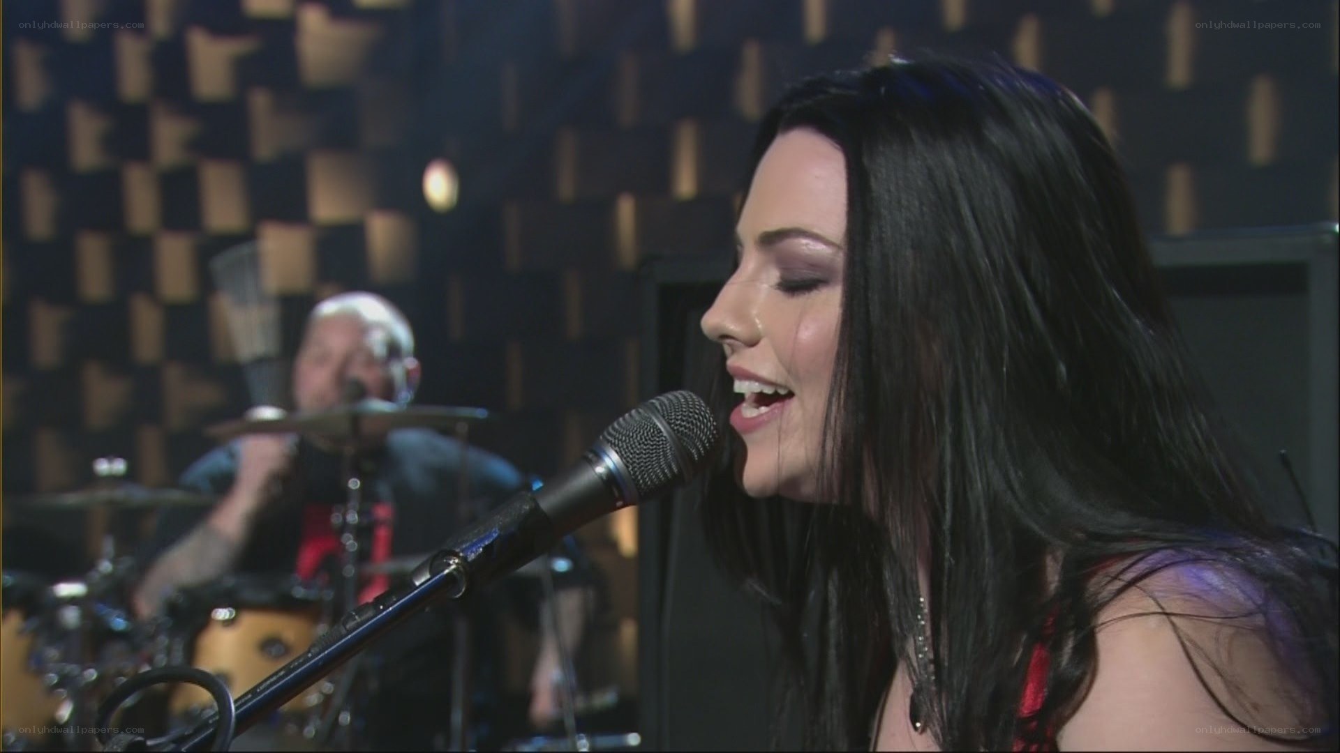woman singing into microphone