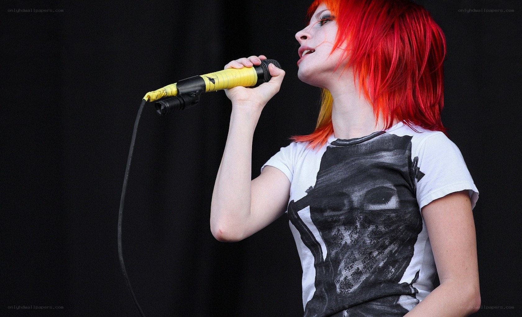 woman singing into microphone