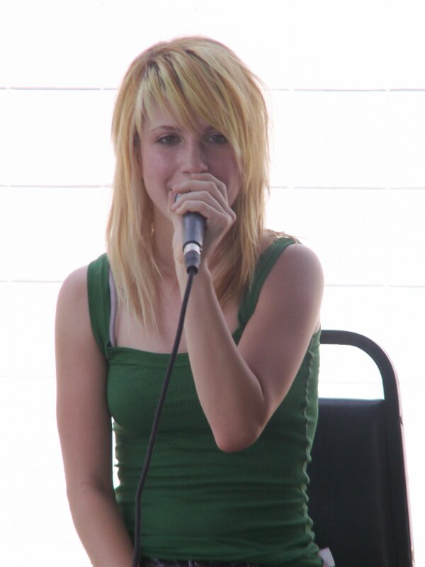 woman singing into microphone