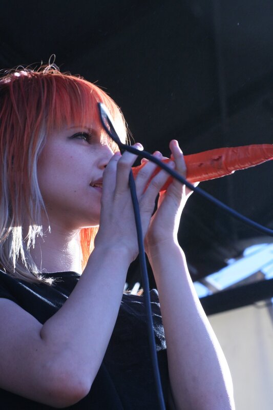 woman singing into microphone