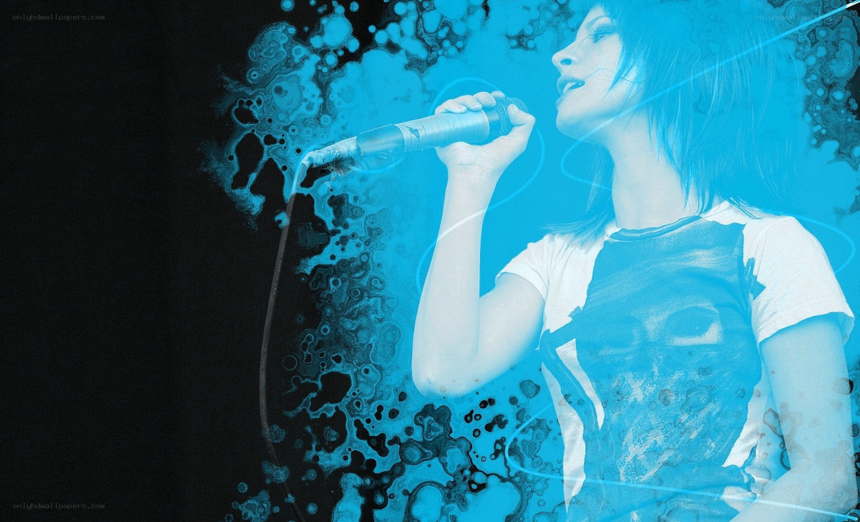 woman singing into microphone