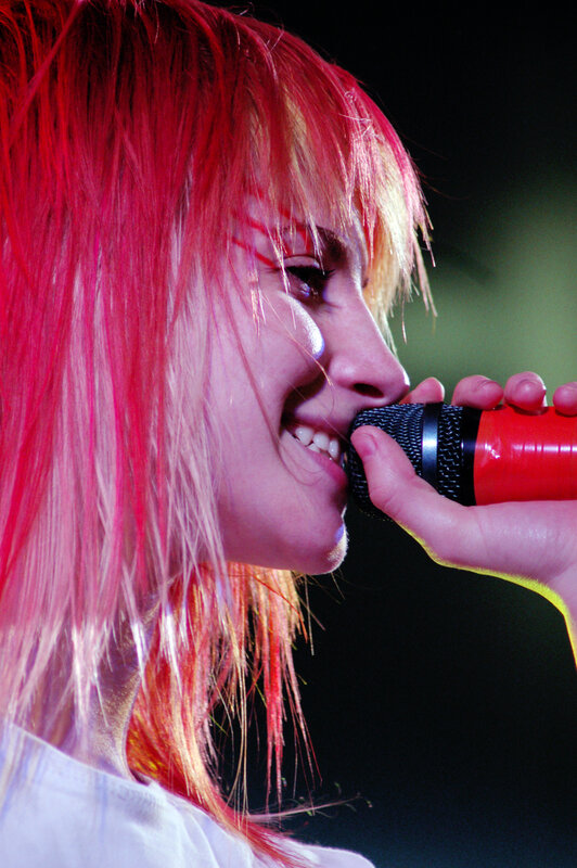 woman singing into microphone