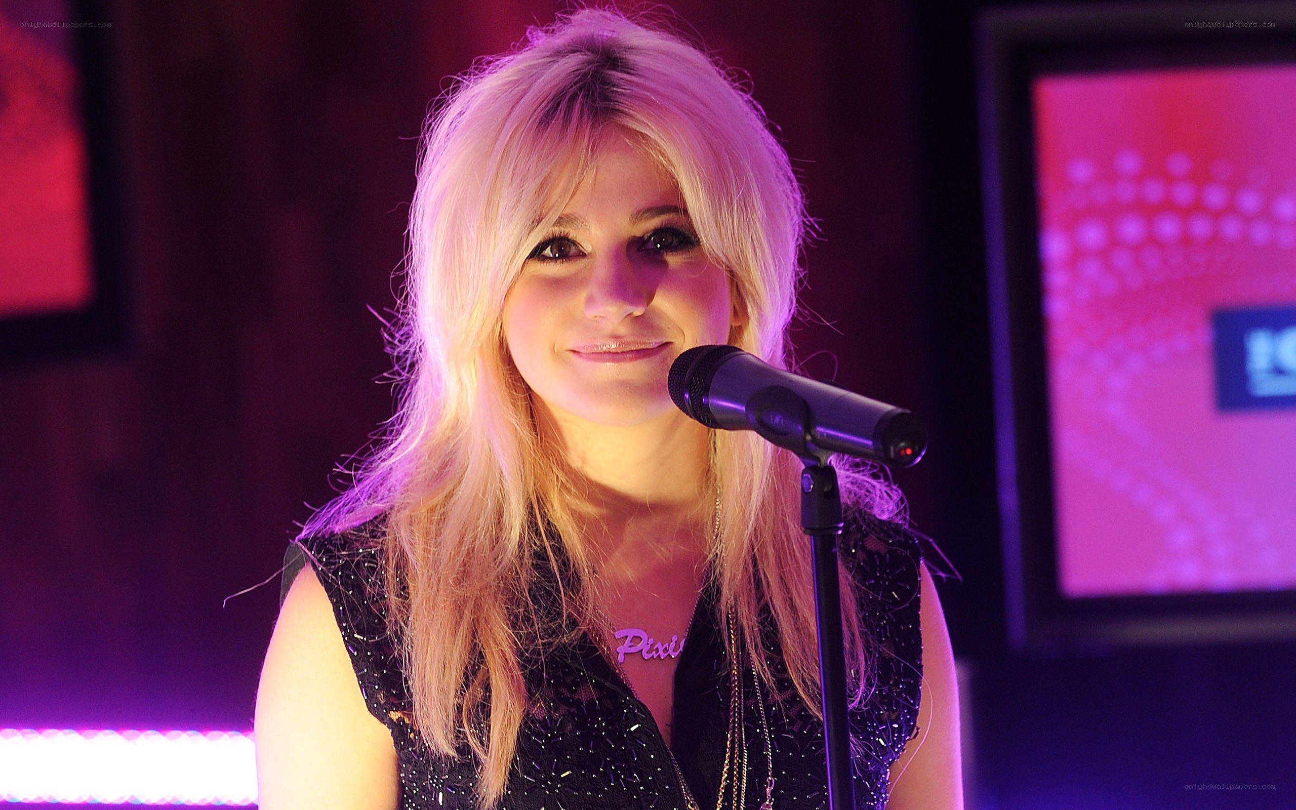 woman singing into microphone
