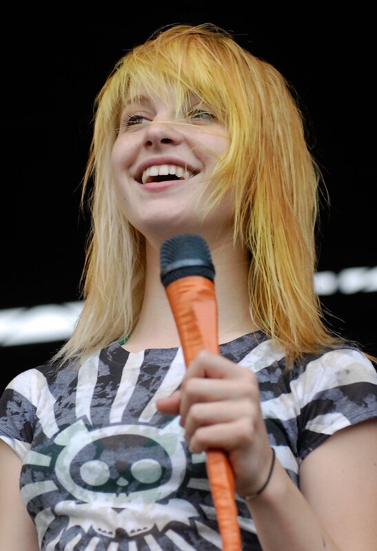 woman singing into microphone