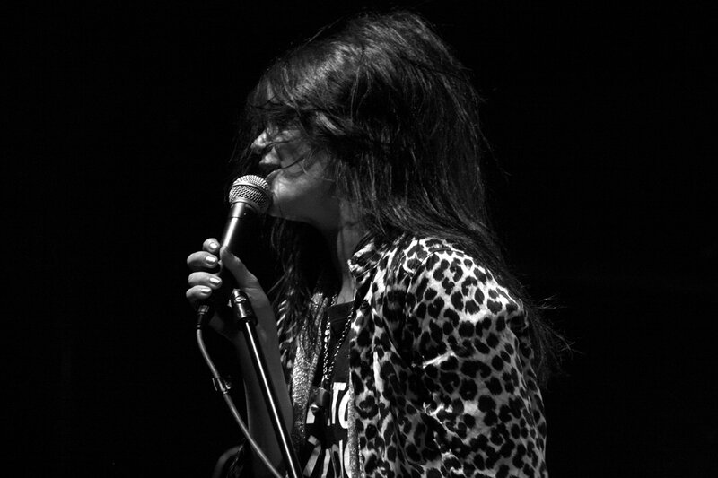 woman singing into microphone