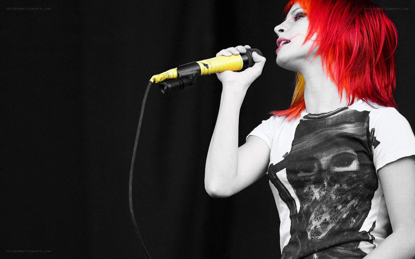 woman singing into microphone