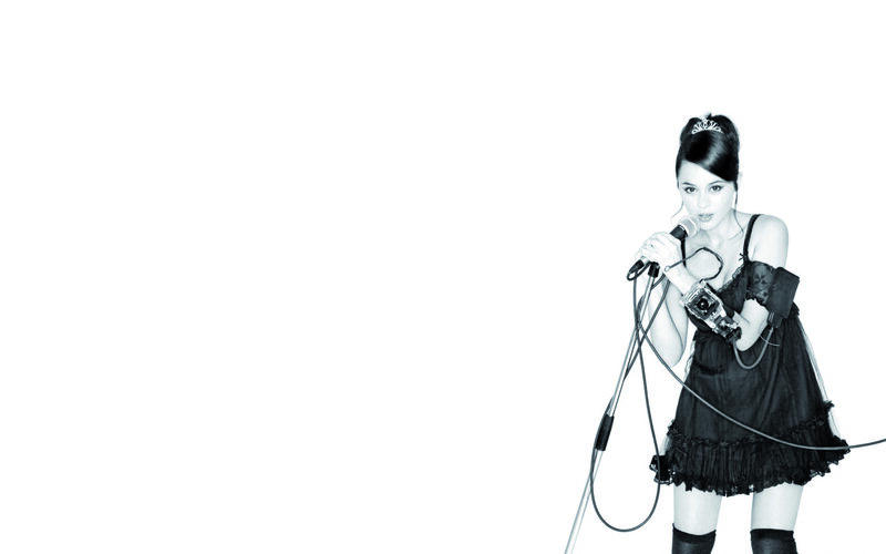 woman singing into microphone