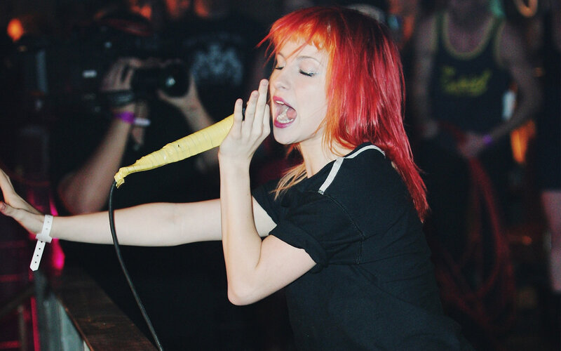 woman singing into microphone