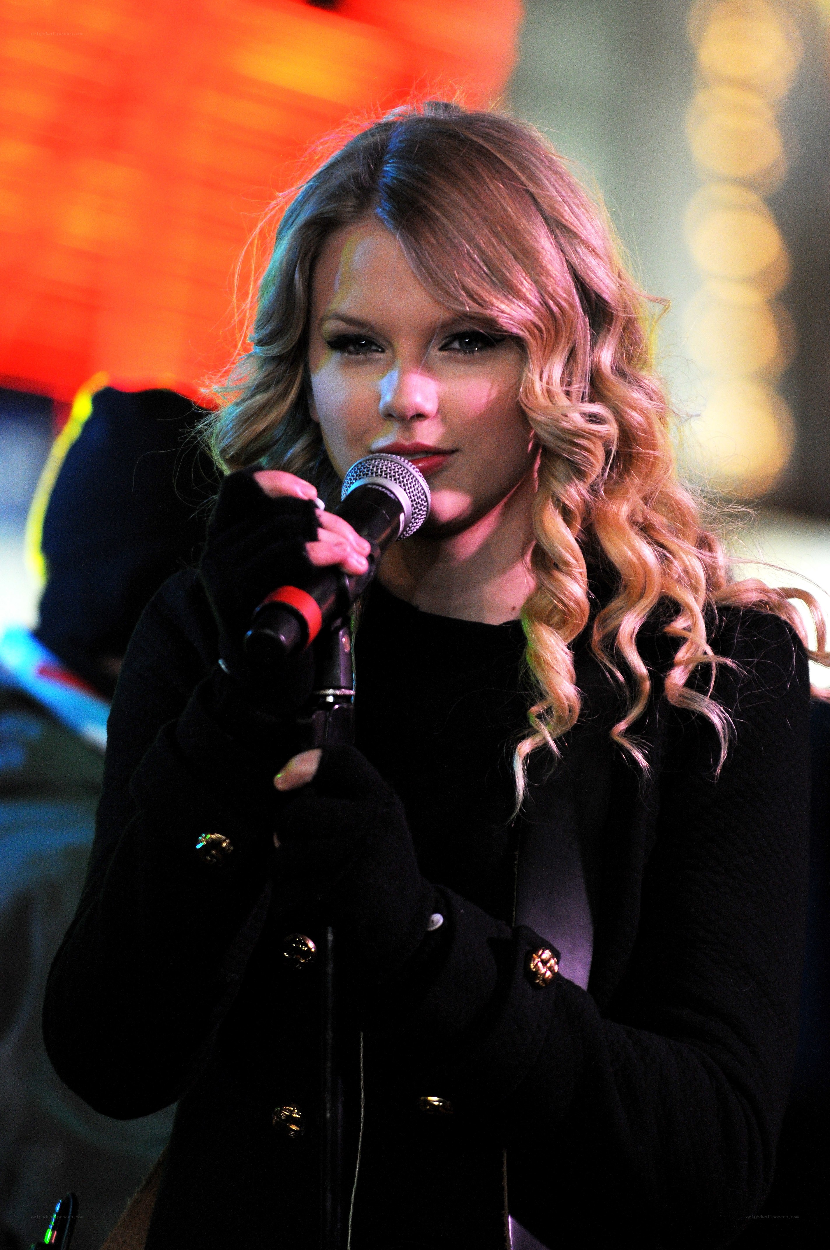 woman singing into microphone