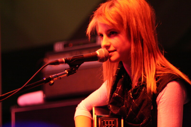 woman singing into microphone