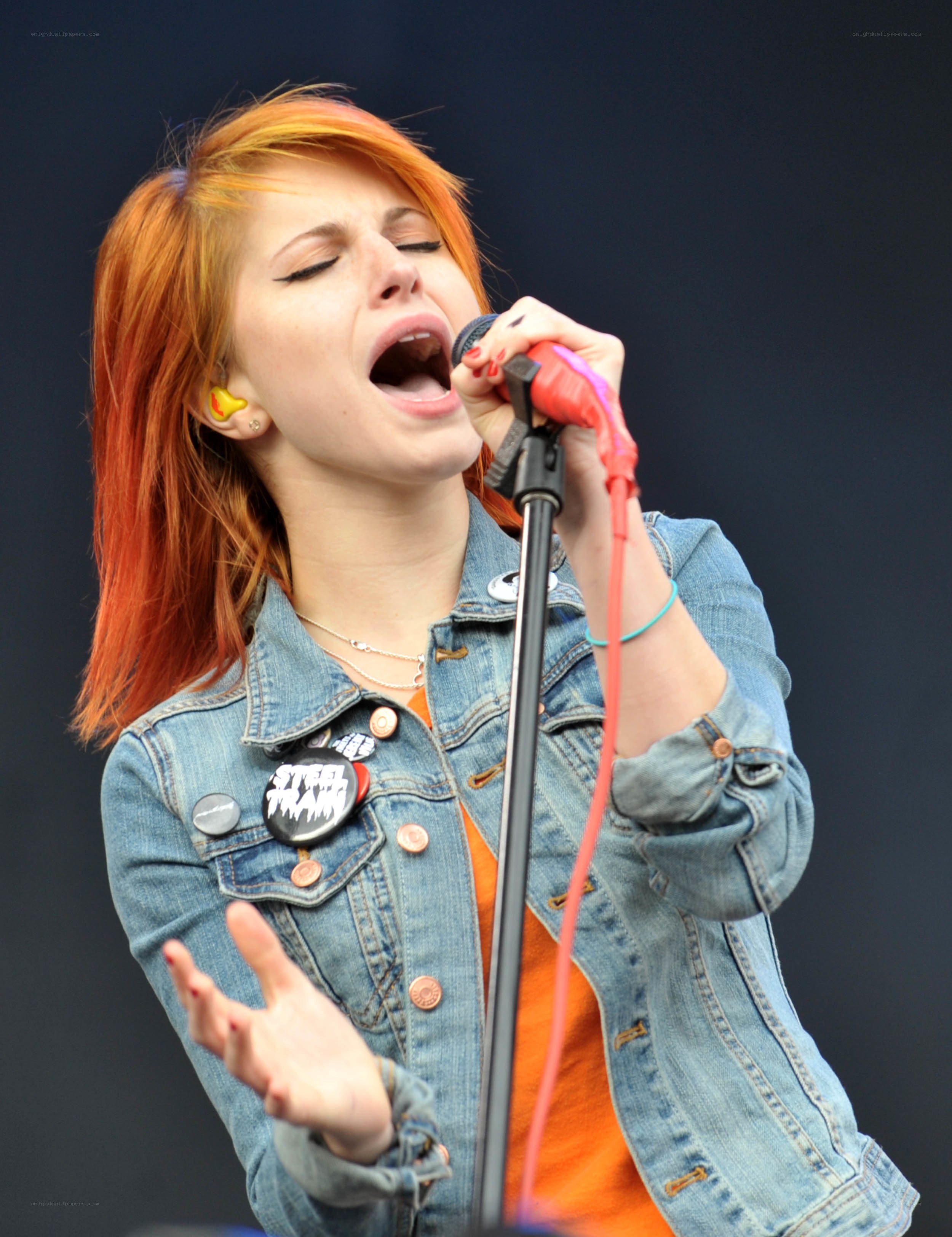 woman singing into microphone