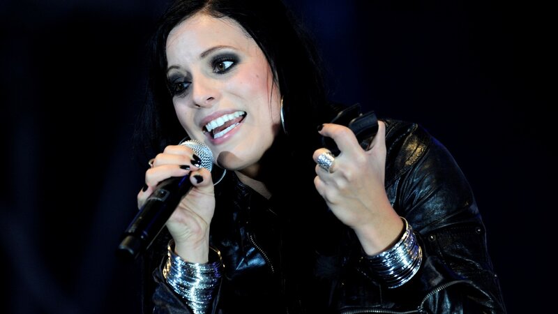 woman singing into microphone
