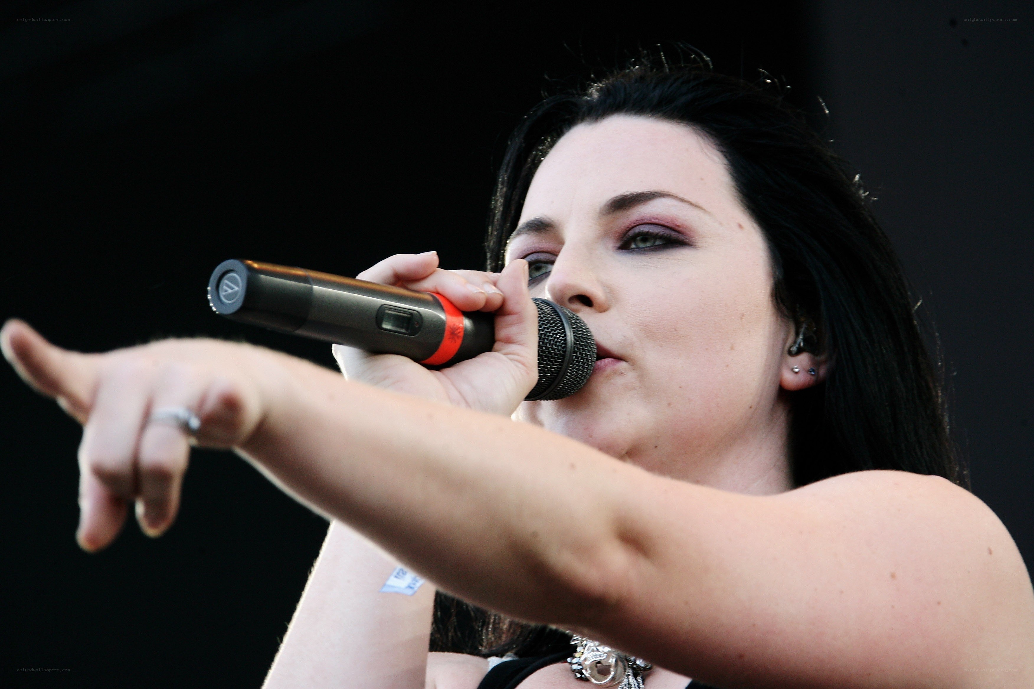 woman singing into microphone