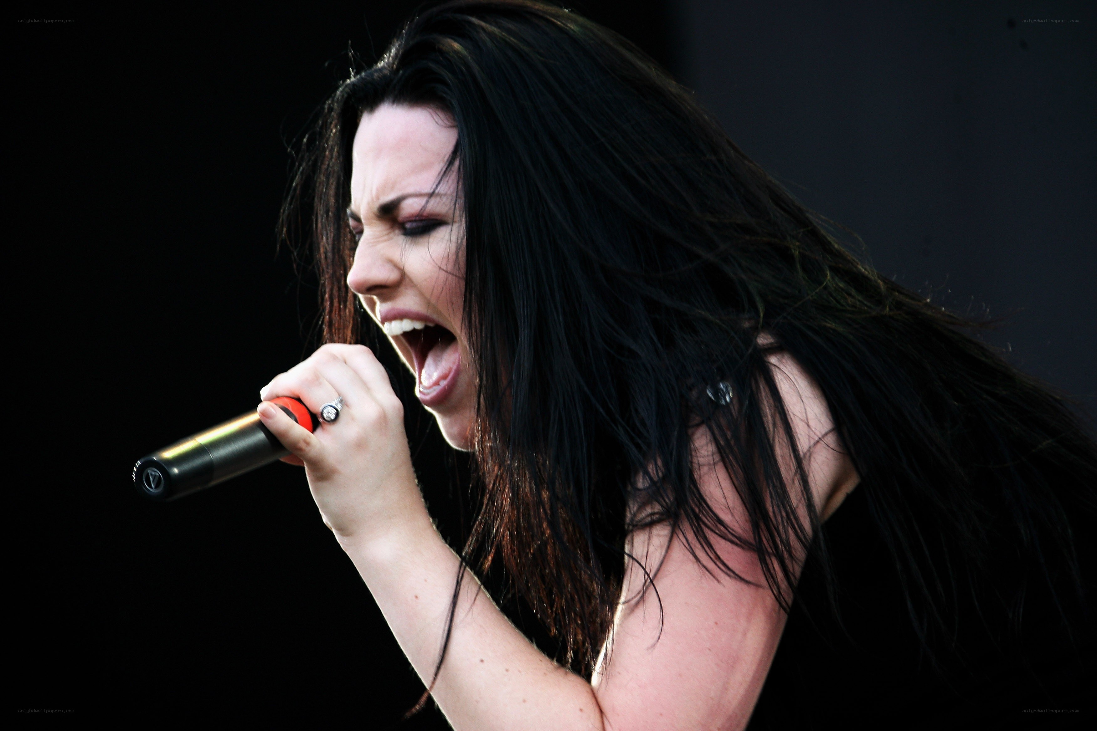 woman singing into microphone