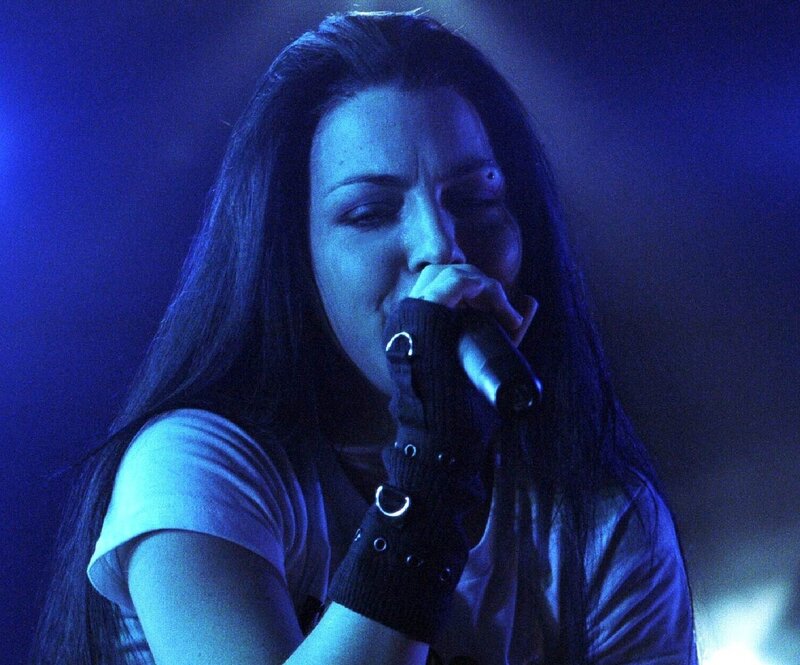 woman singing into microphone