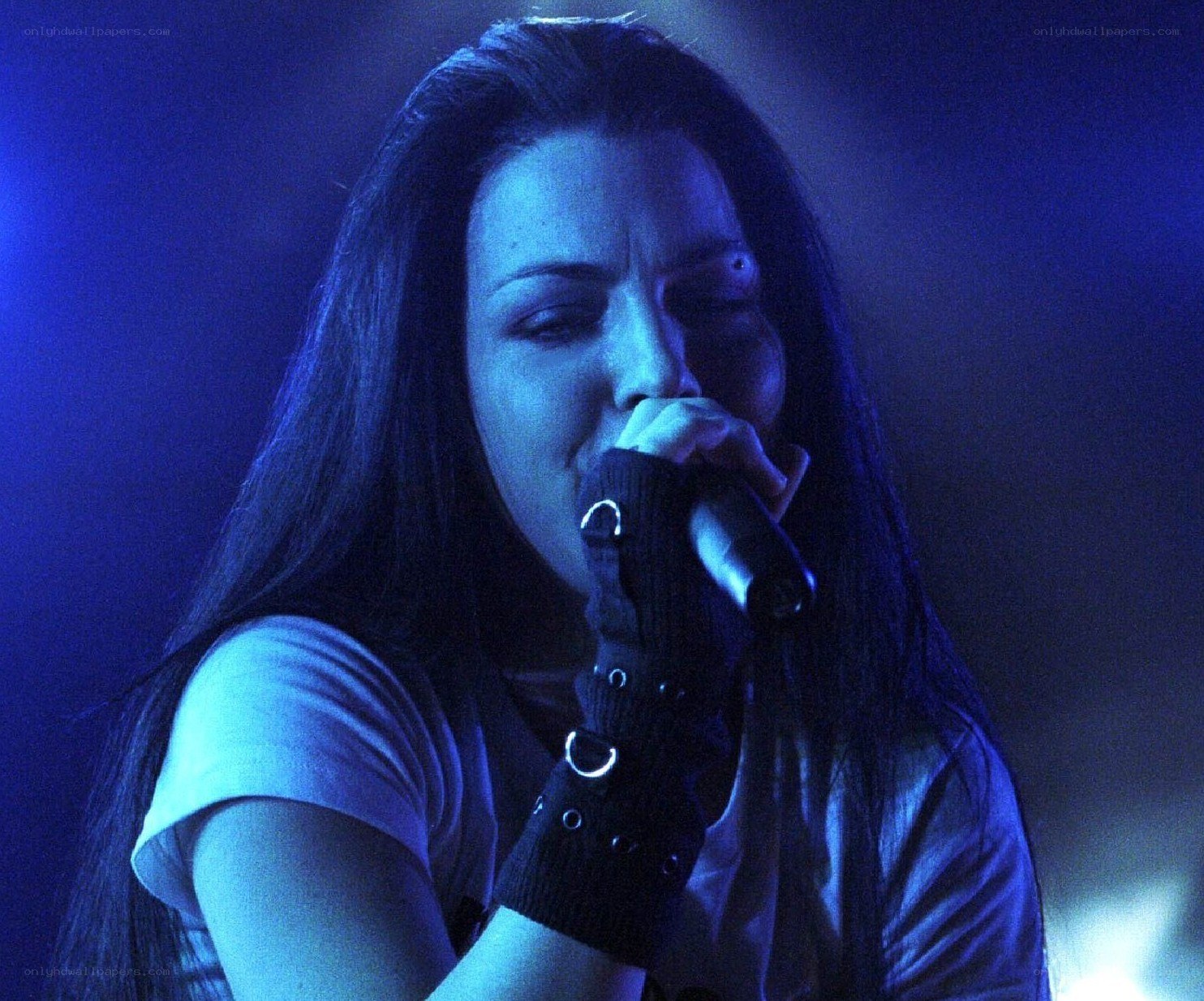 woman singing into microphone