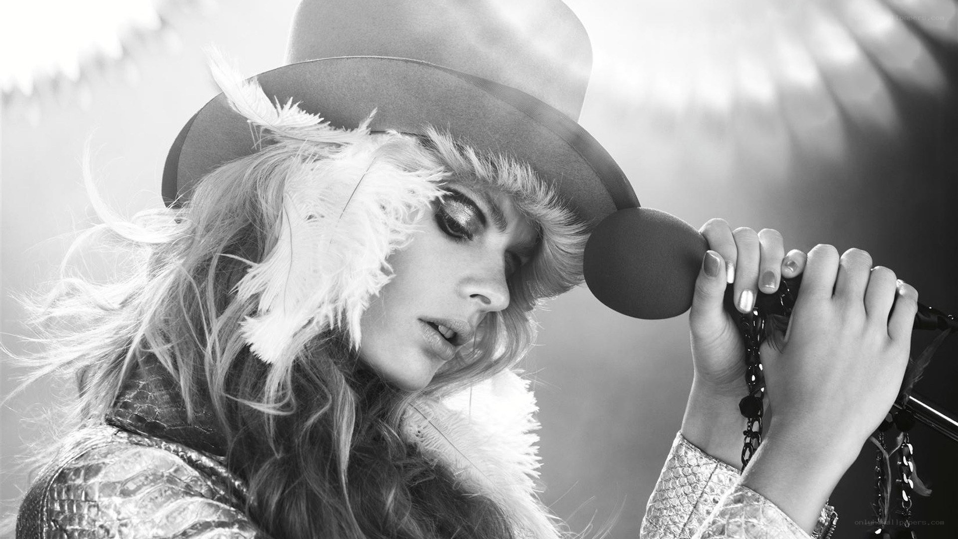 woman singing into microphone