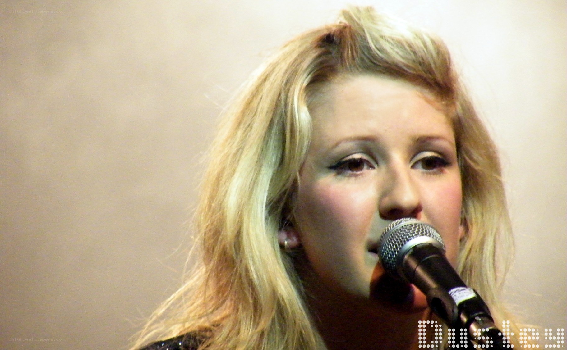 woman singing into microphone