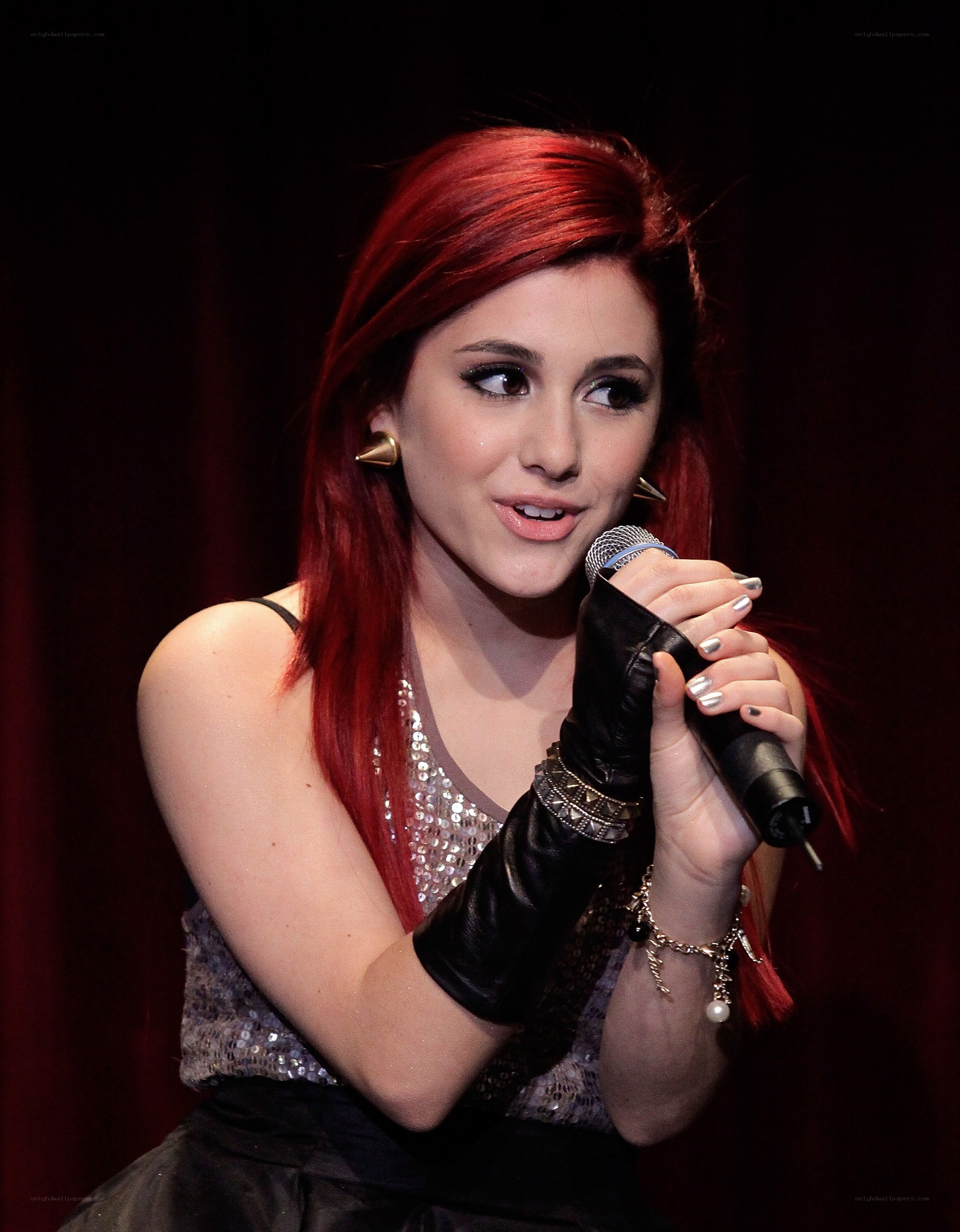 woman singing into microphone